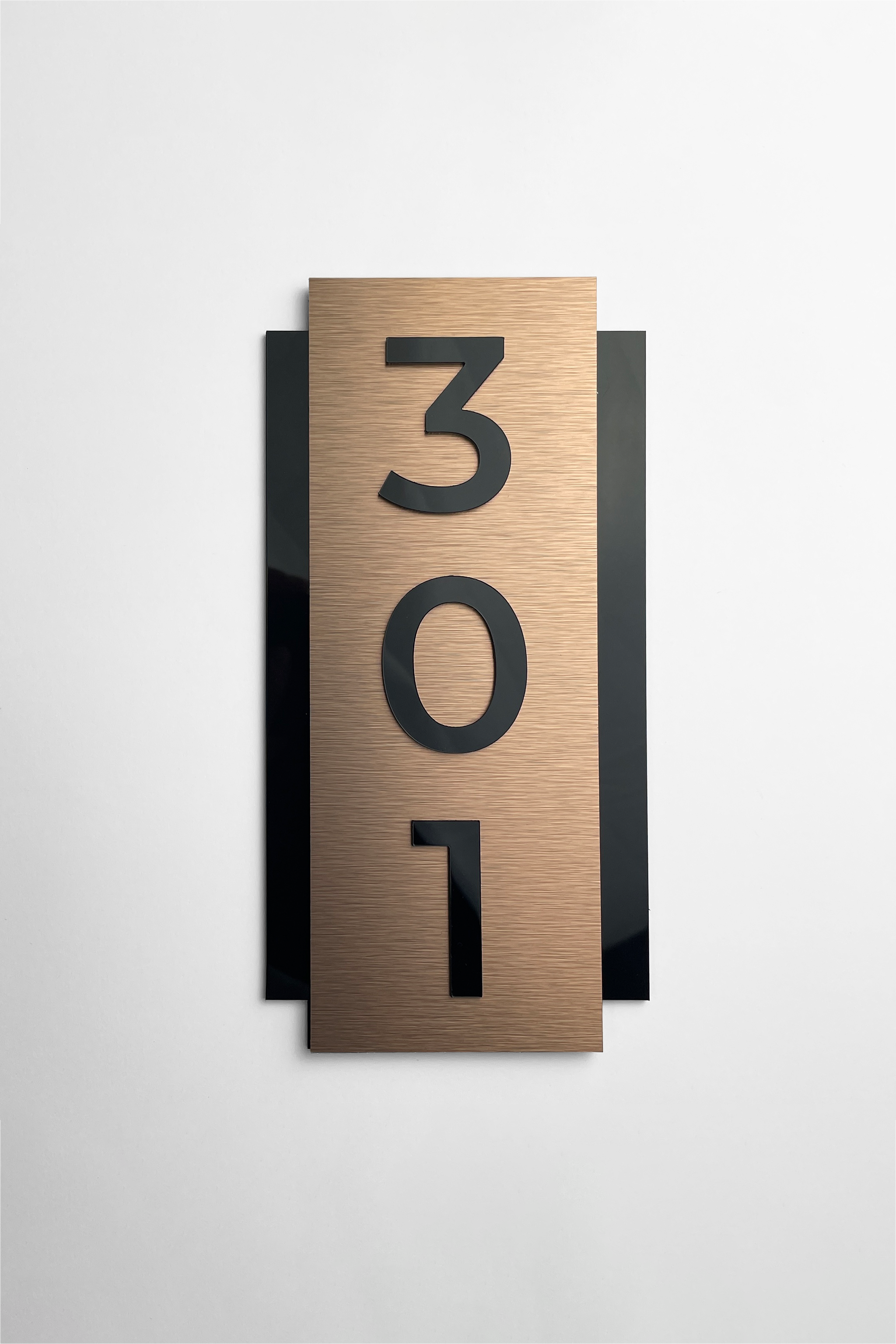 ALUMADESIGNCO vertical room number sign with brushed bronze plaque and black acrylic glass numbers, modern hotel door number signage for boutique hotels, apartments, and luxury interiors