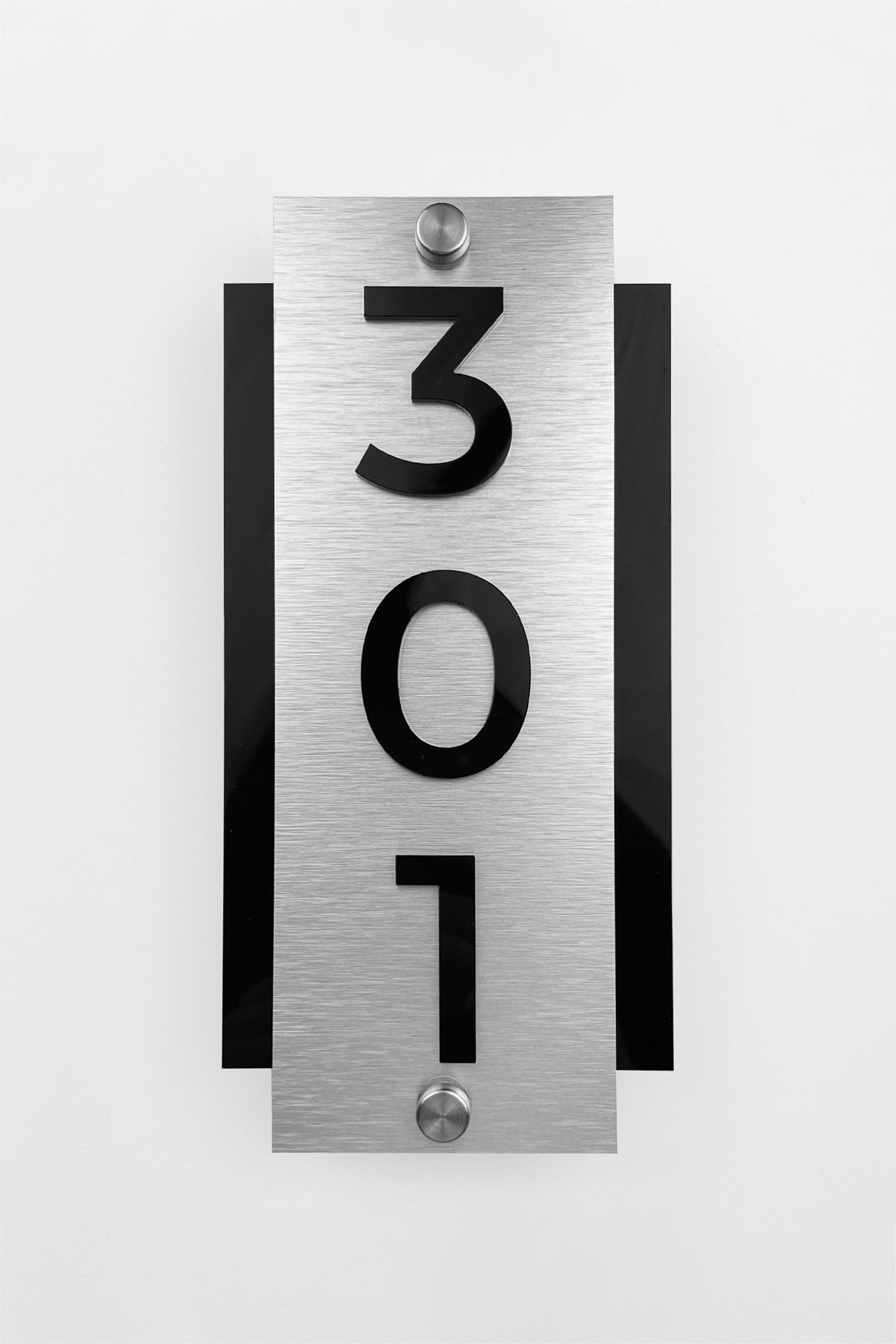 Modern vertical hotel door number sign with brushed silver plaque and acrylic numbers by ALUMADESIGNCO, standoff mounted signage for boutique hotels and apartments