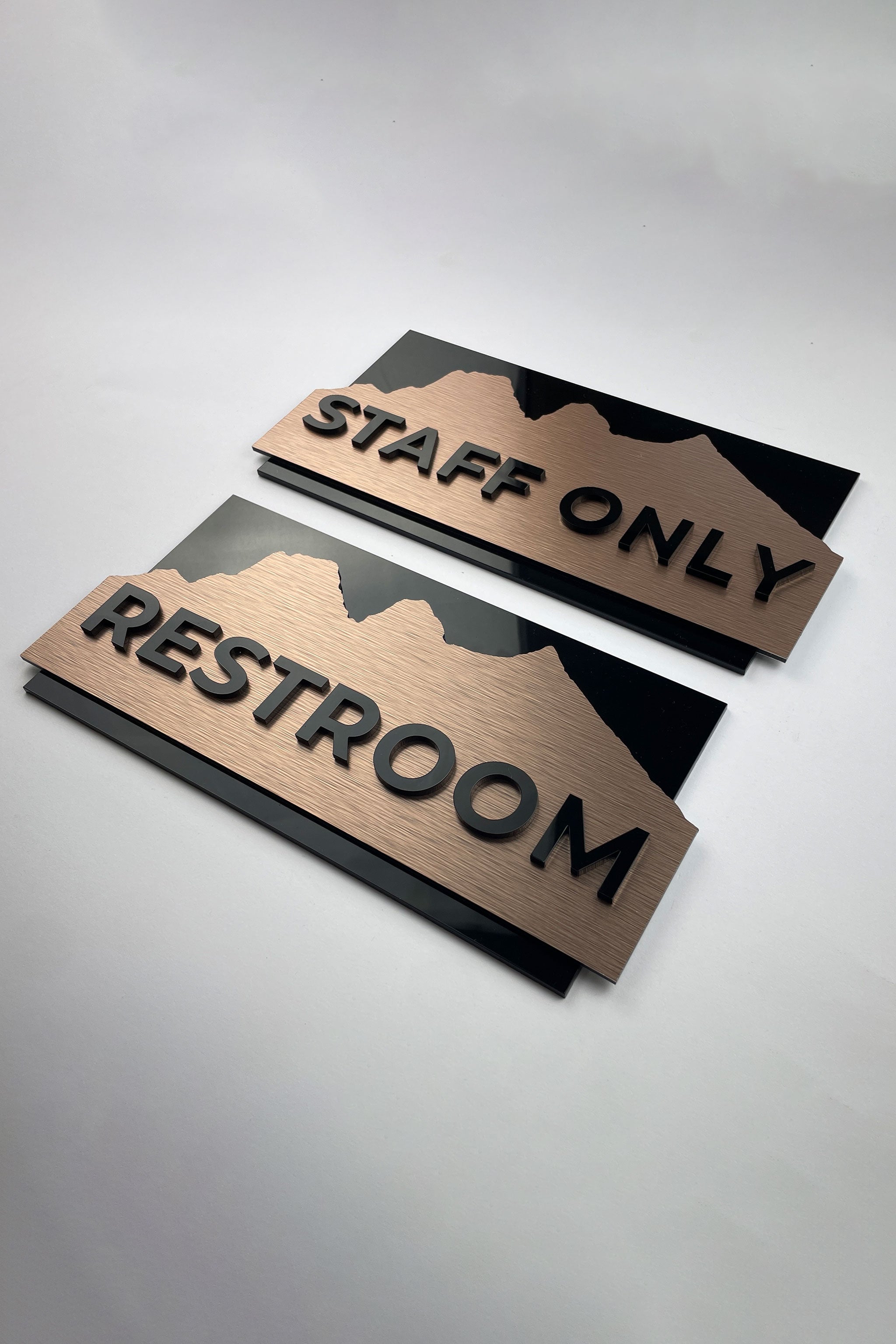 ALUMADESIGNCO brushed bronze door plaque with 3D black acrylic text, modern custom signage for hotels, Airbnb properties, and office doors