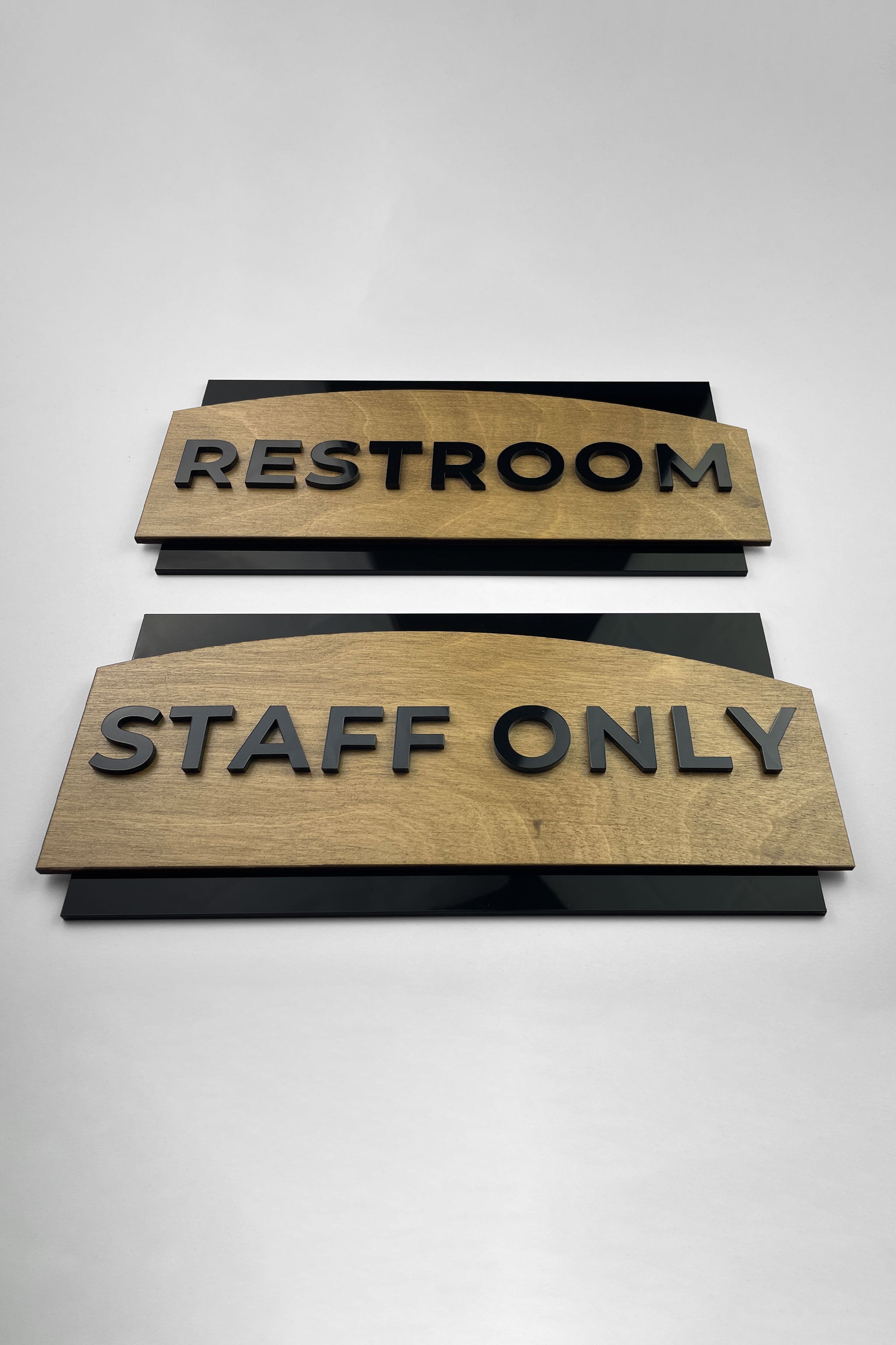 ALUMADESIGNCO birch wood style door plaque with black acrylic lettering, modern custom signage for offices, hotels, and residential spaces