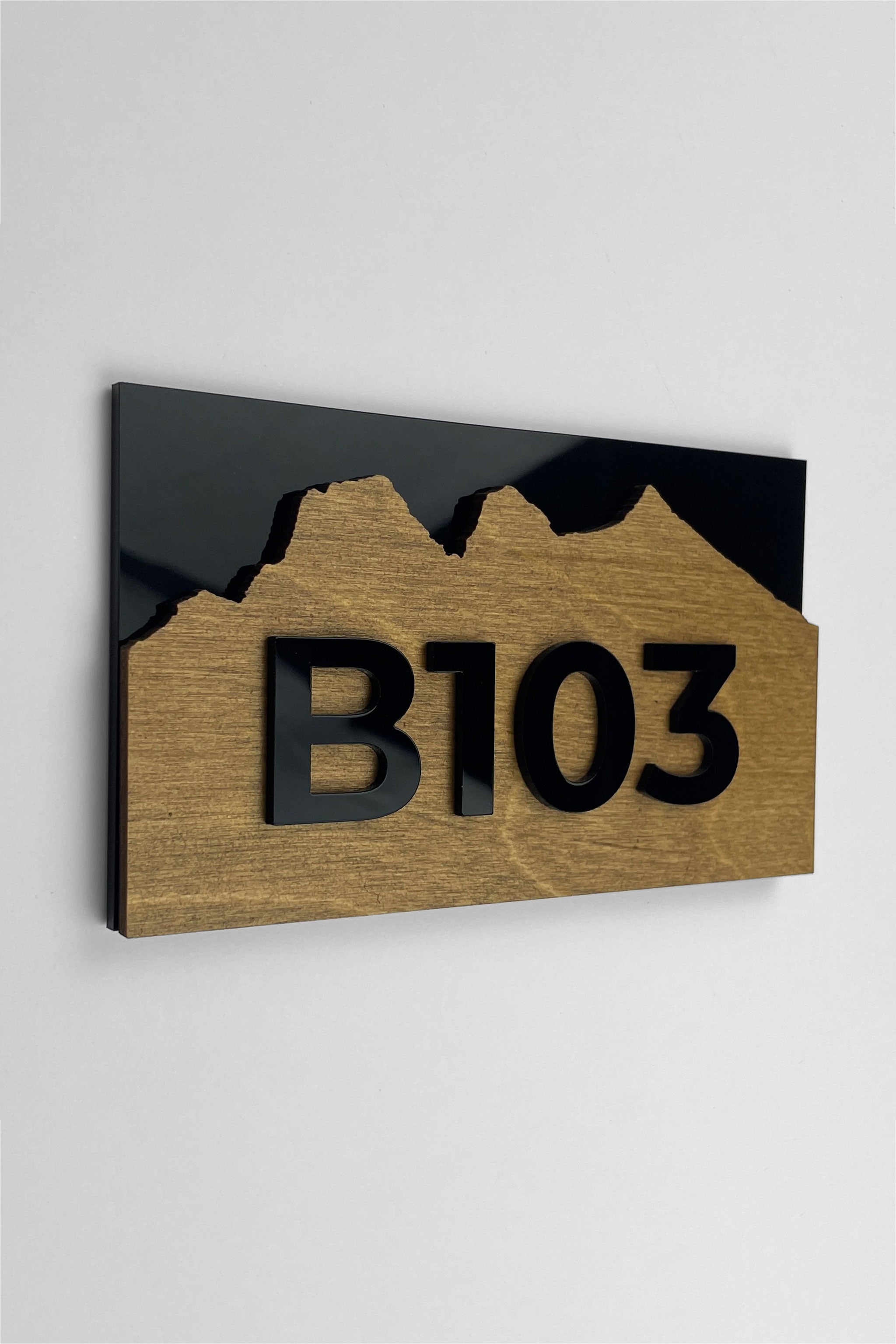 Birch plywood apartment door number sign Alpine Design by ALUMADESIGNCO featuring natural wood base and acrylic glass numbers for modern apartment and hotel interiors