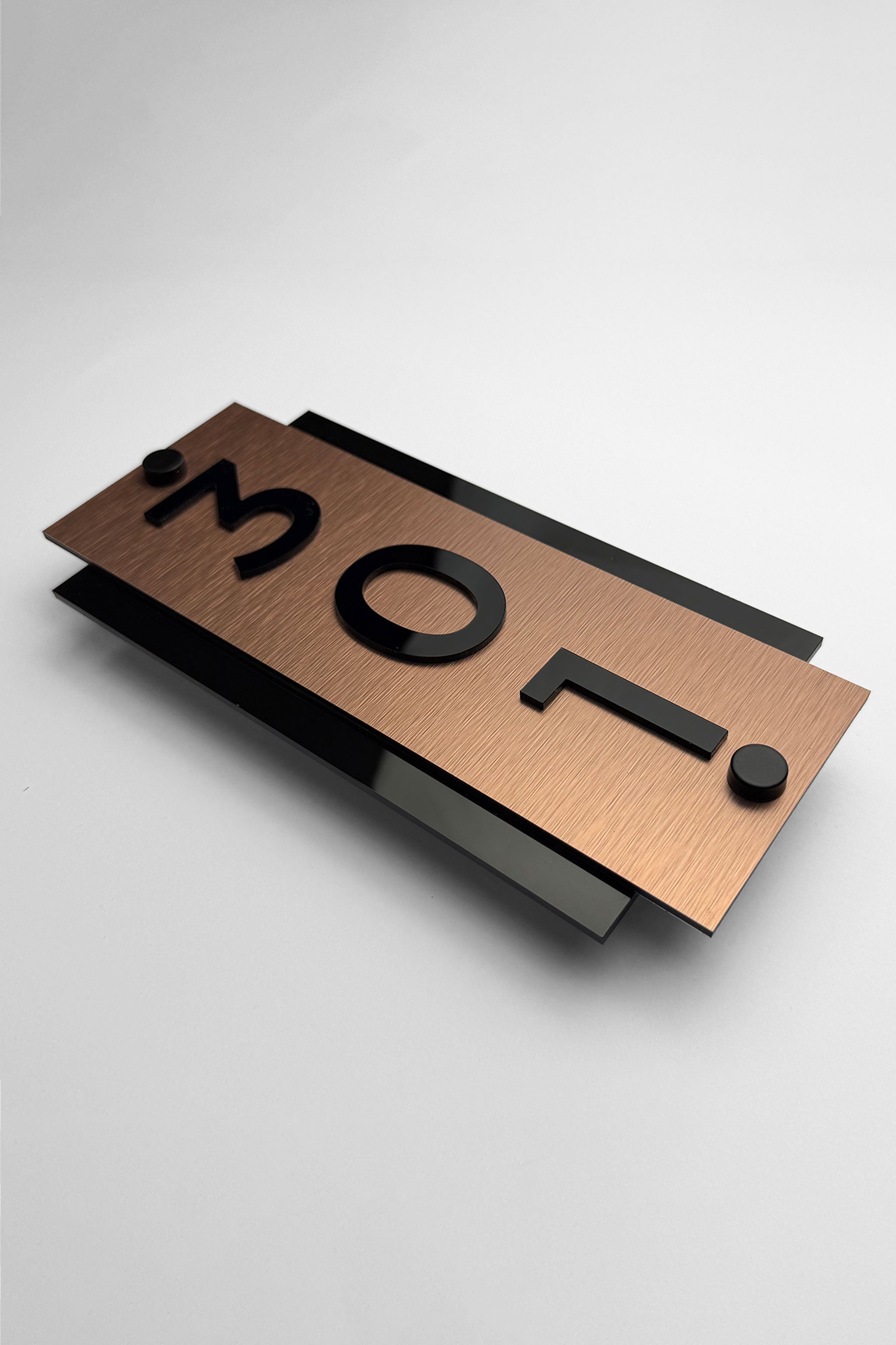 ALUMADESIGNCO vertical brushed bronze room number plaque with acrylic numbers and standoff mounting, modern hotel signage for boutique hotels and apartments
