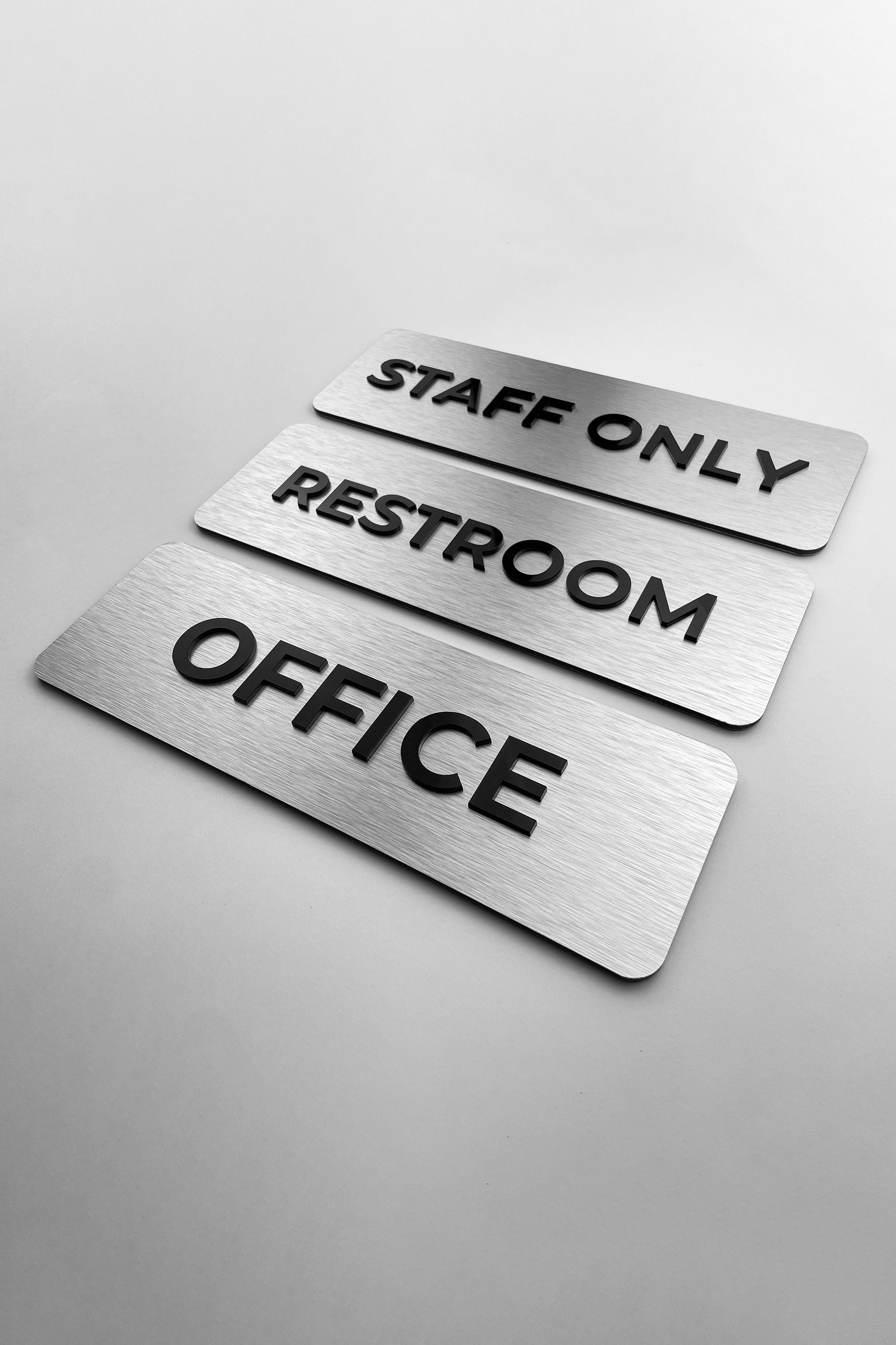 Custom silver metal and black acrylic office door sign by ALUMADESIGNCO, elegant plaque for offices, meeting rooms, and contemporary interiors