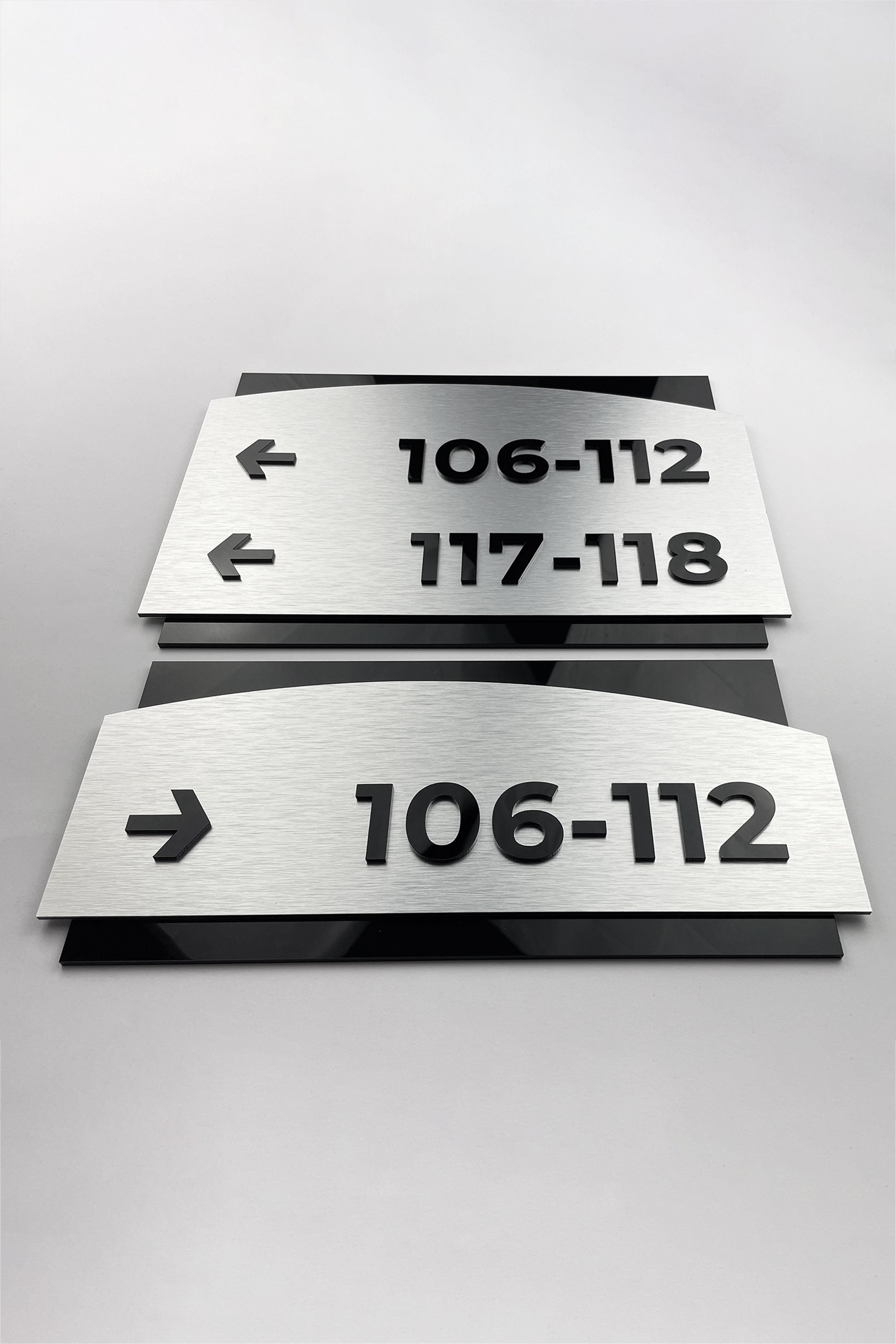 Premium Flow directional wall sign by ALUMADESIGNCO, modern wayfinding signage for offices, hotels, apartment buildings, and commercial interiors