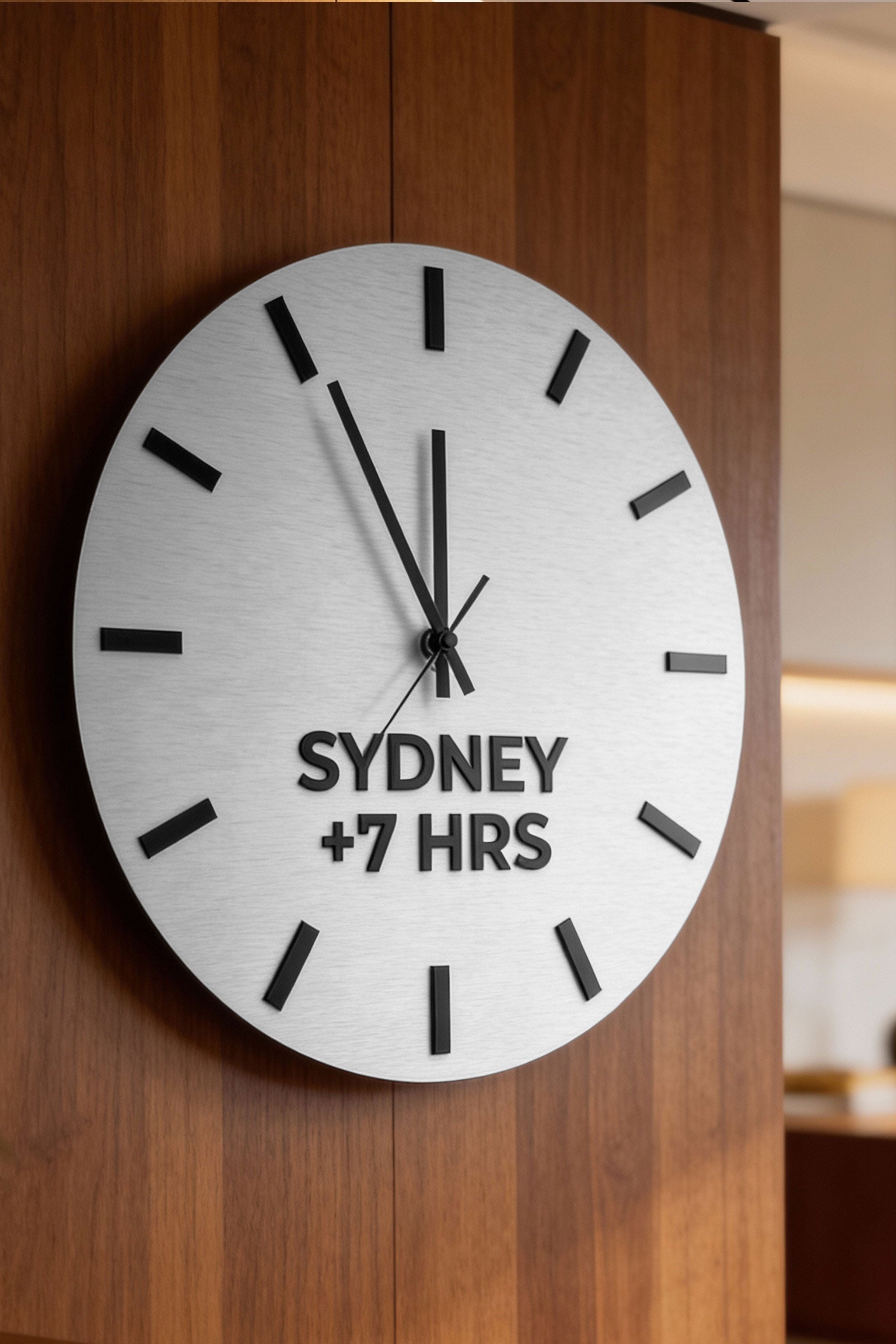 Brushed silver world clock with custom city name plates by ALUMADESIGNCO, premium time zone wall décor for offices, studios, hotels, and corporate interiors