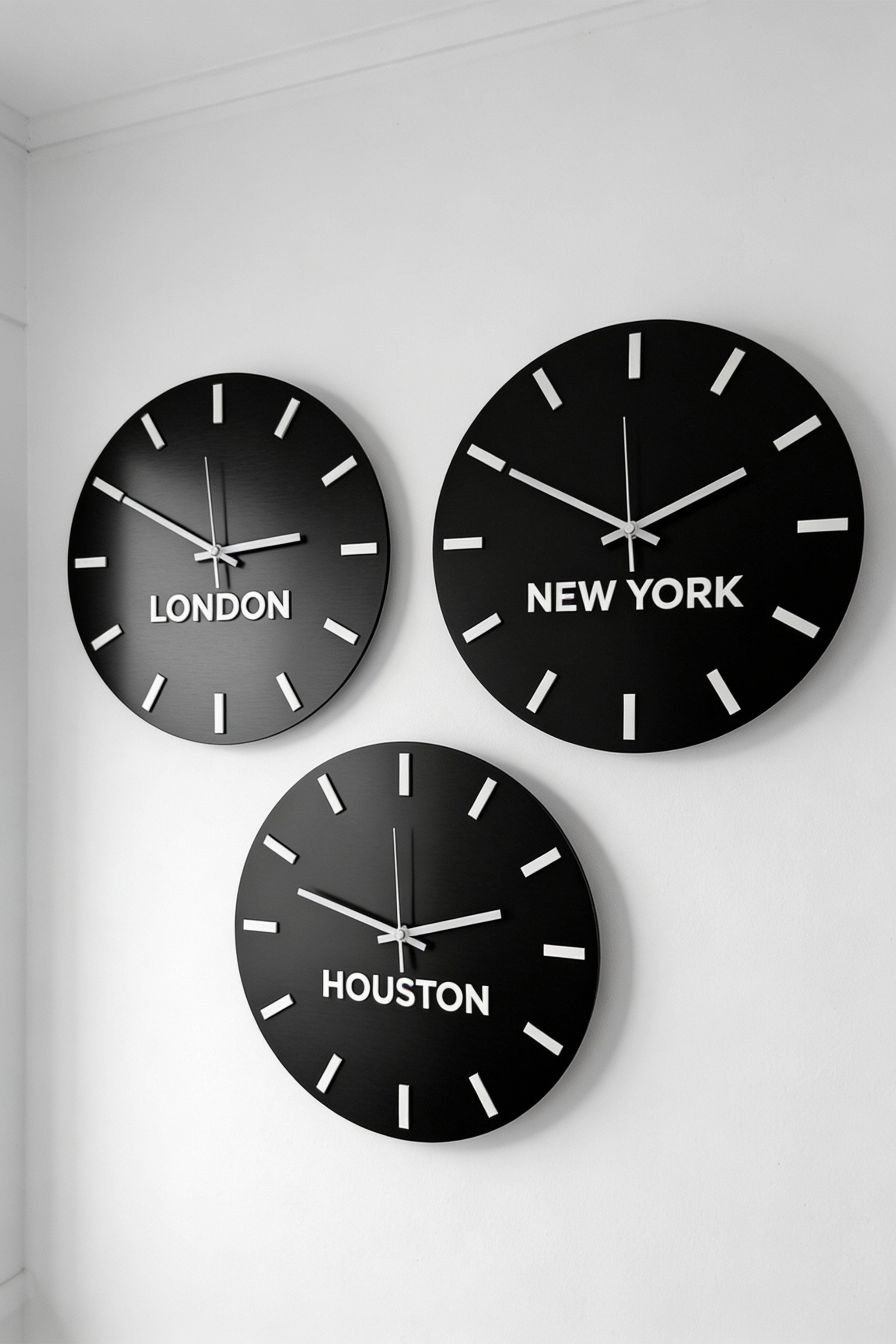 Modern personalized world time zone clock by ALUMADESIGNCO with brushed black panel and white acrylic glass city names, stylish wall décor for offices and hospitality spaces