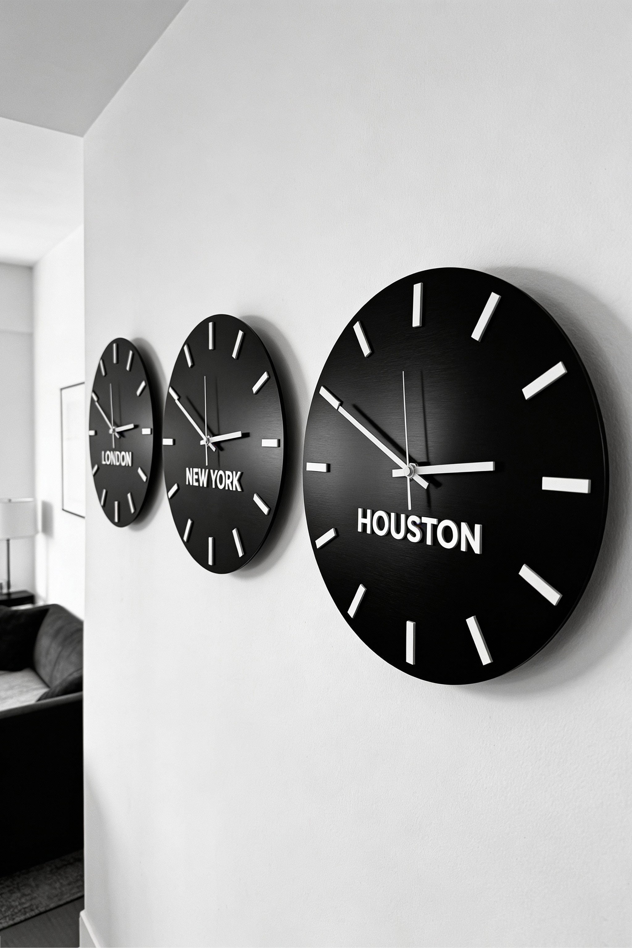 ALUMADESIGNCO international time zone wall clock in brushed black and white acrylic glass with personalized city displays, elegant décor for hotels, lobbies, apartments, and modern interiors