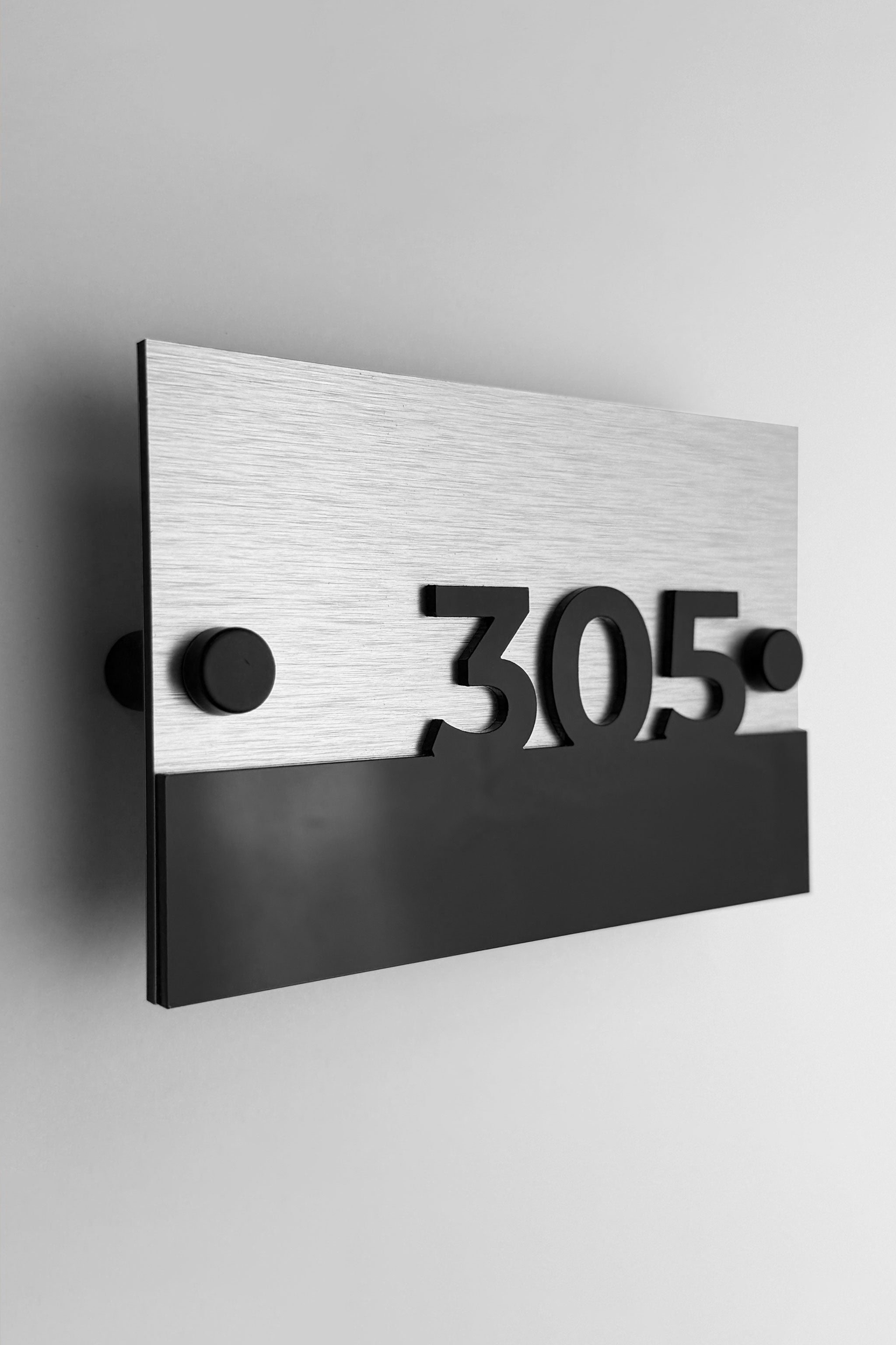 Modern Horizon Design standoff wall number plaque by ALUMADESIGNCO with brushed silver metal base and 3D black acrylic numbers, stylish signage for hotel corridors and apartment buildings
