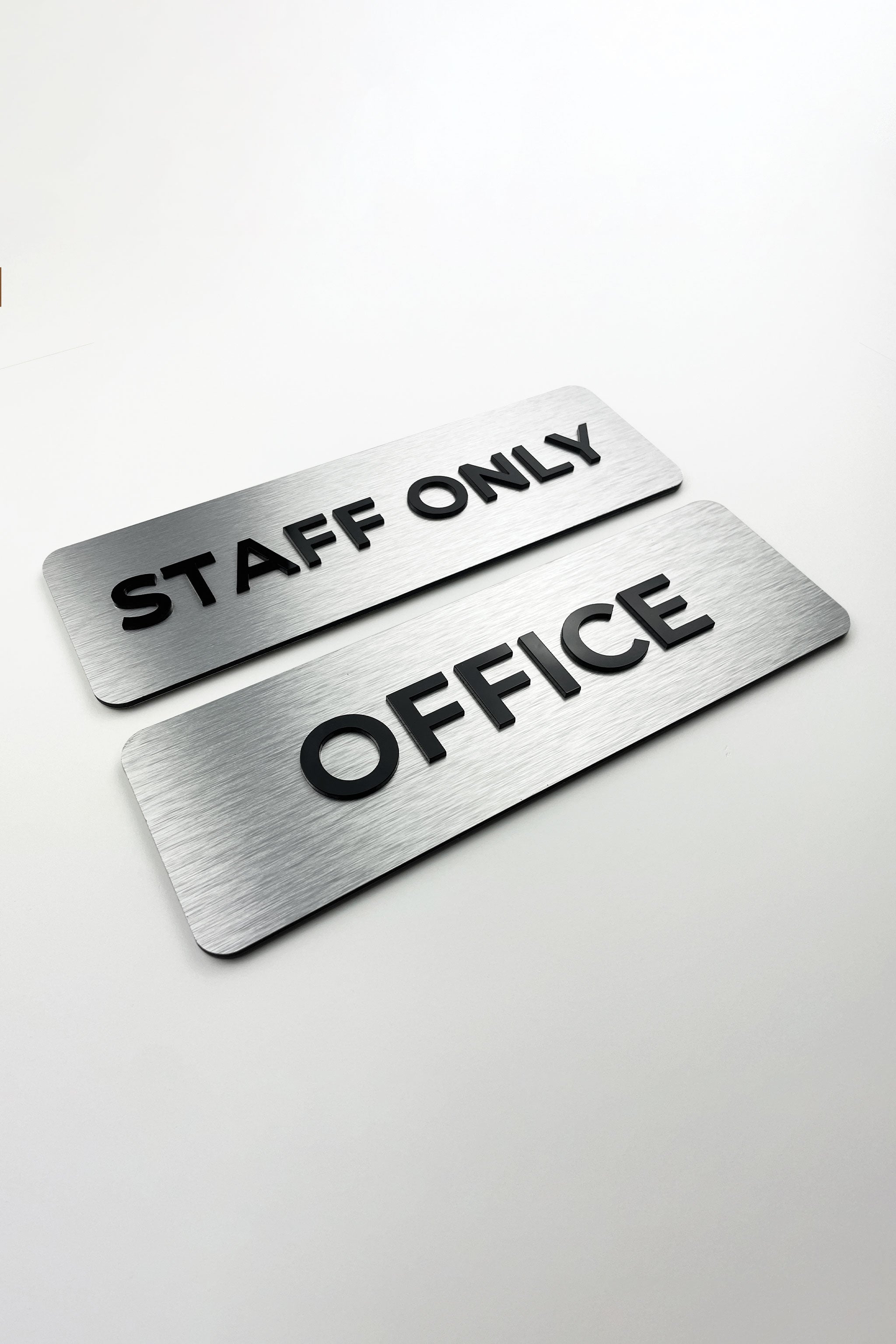 ALUMADESIGNCO custom silver metal and black acrylic door sign with minimalist modern design, premium signage for offices, hotels, and apartments