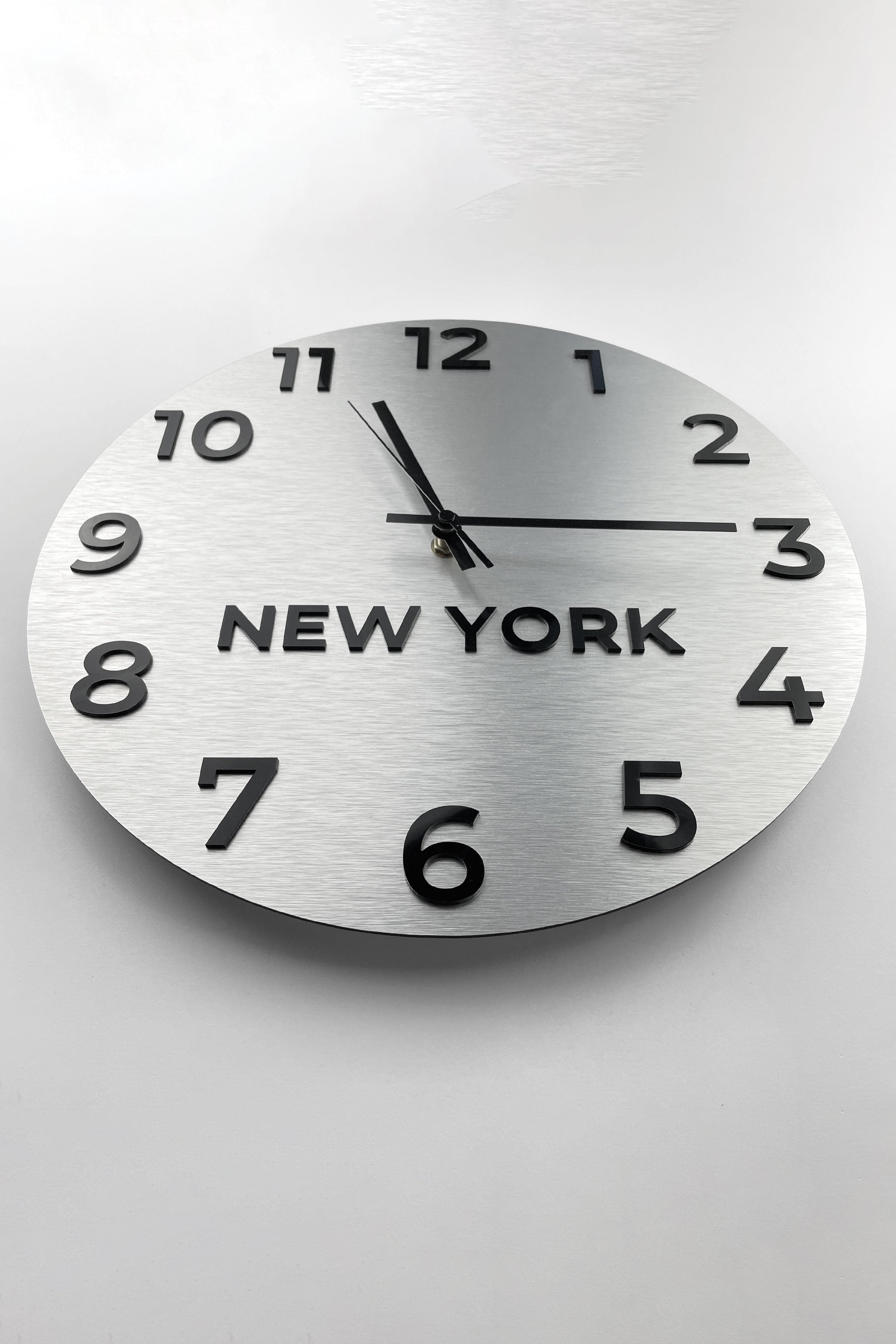 Elegant international time zone wall clock by ALUMADESIGNCO featuring multiple city name displays, stylish wall clock for offices, hotels, conference rooms, and modern spaces