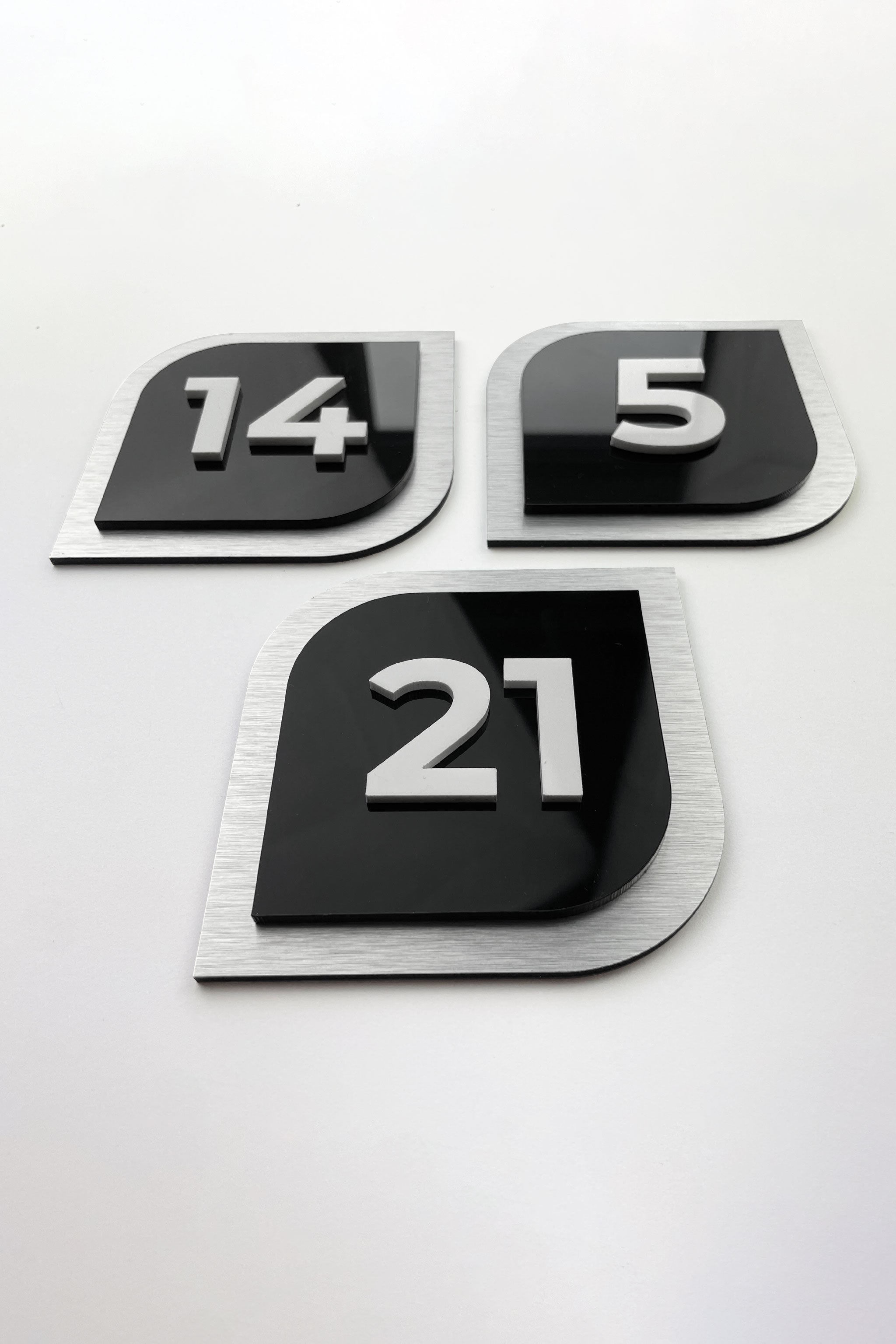 3D hotel door number plate by ALUMADESIGNCO featuring raised acrylic numbers, modern interior signage for hotel rooms and apartment doors