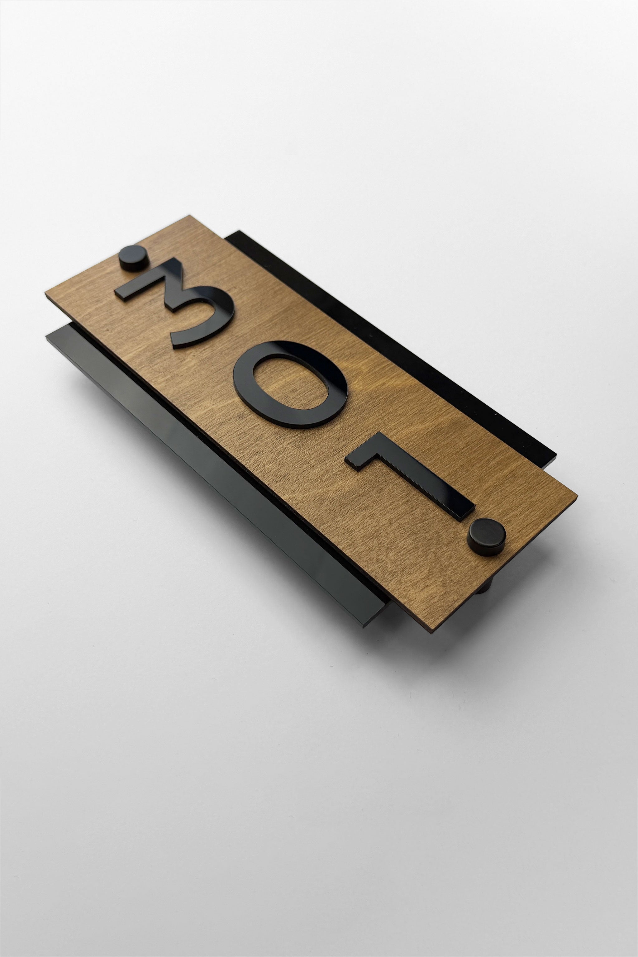 Modern standoff vertical hotel door number sign by ALUMADESIGNCO featuring birch plywood base and black acrylic numbers, elegant wood and acrylic signage for hotel rooms and apartments
