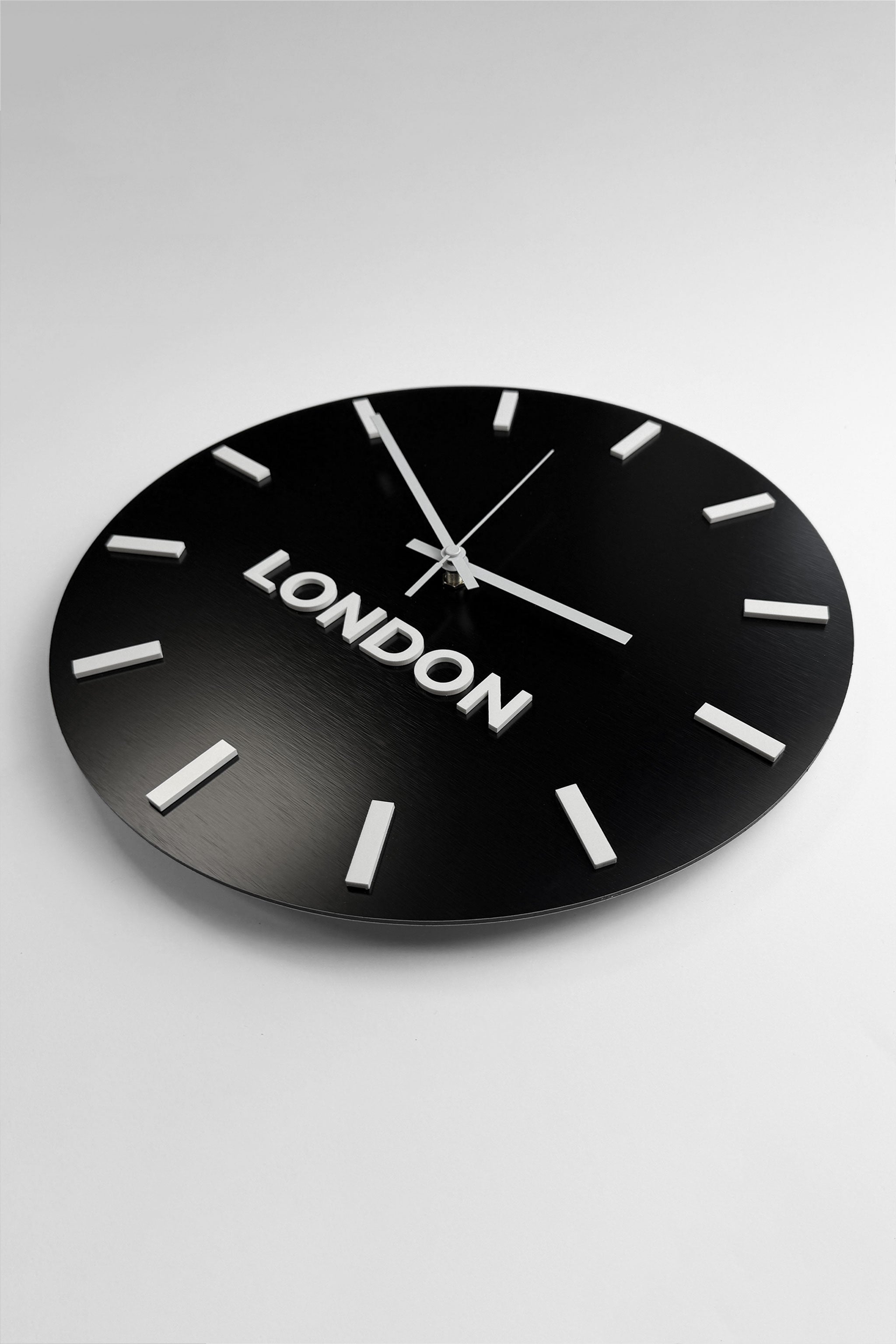 ALUMADESIGNCO brushed black world clock with white acrylic glass and custom city labels, premium time zone wall décor for offices, hotels, conference rooms, and business interiors