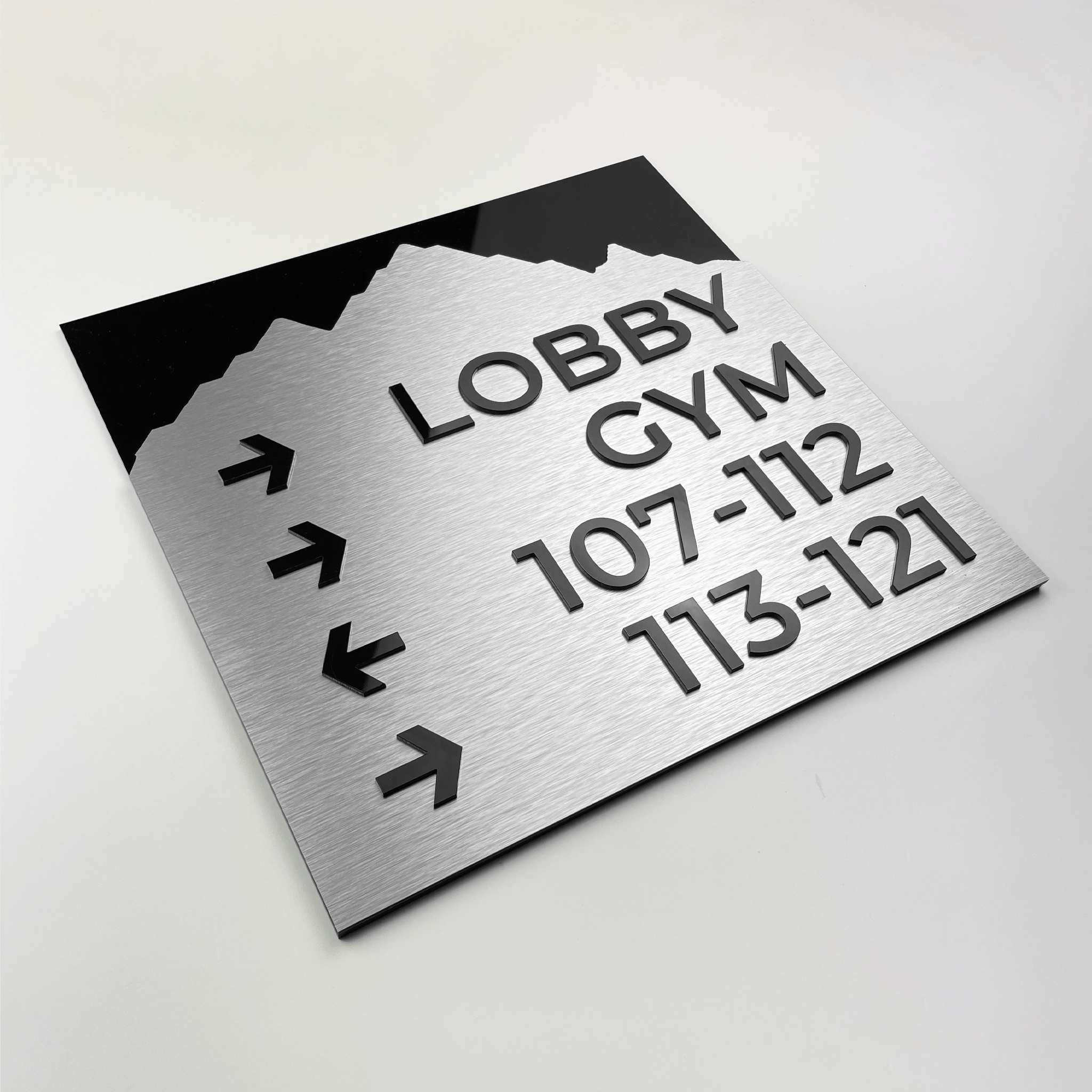 Directional wayfinding sign in aluminium plate standard design mounted on office wall