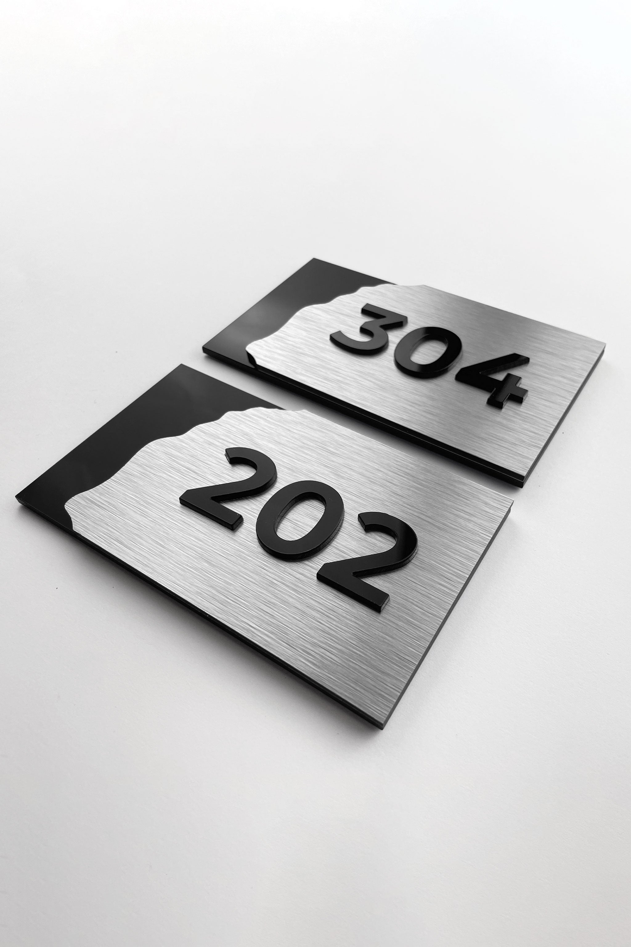 3D layered suite room number sign Fusion Design by ALUMADESIGNCO featuring wood and acrylic layers, modern door plaque for hotel suites and apartment interiors