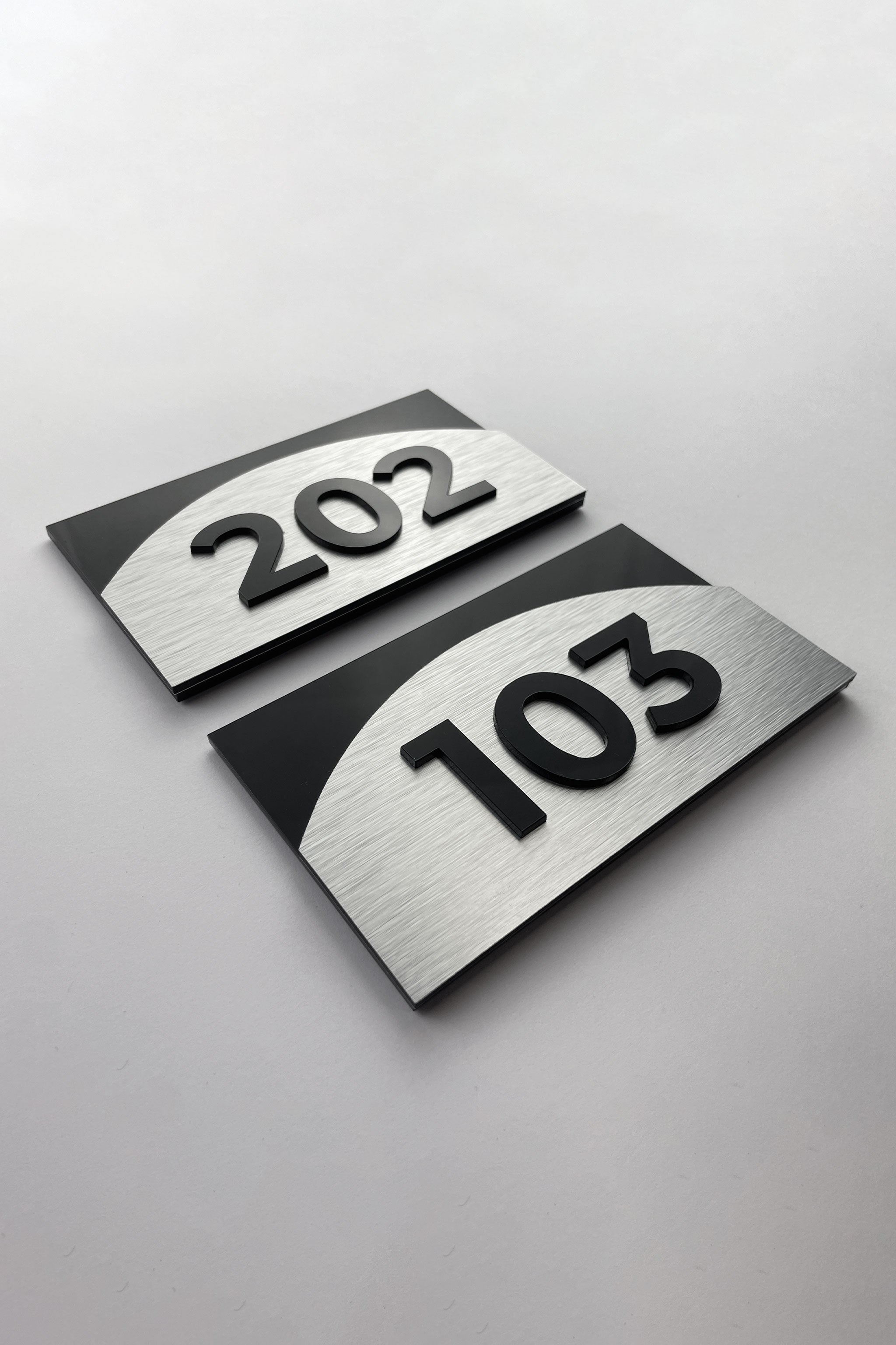 Premium Flow custom 3D layered room number sign by ALUMADESIGNCO featuring raised numbers, elegant door signage for hotels, apartments, and contemporary interiors