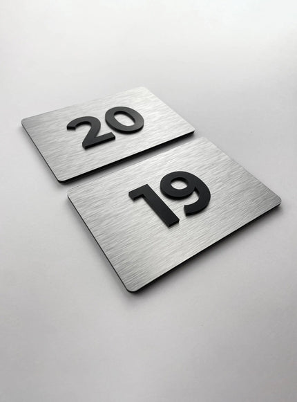 Premium room number sign for doors by ALUMADESIGNCO featuring brushed silver plaque and acrylic numbers, elegant door signage for hotels and offices
