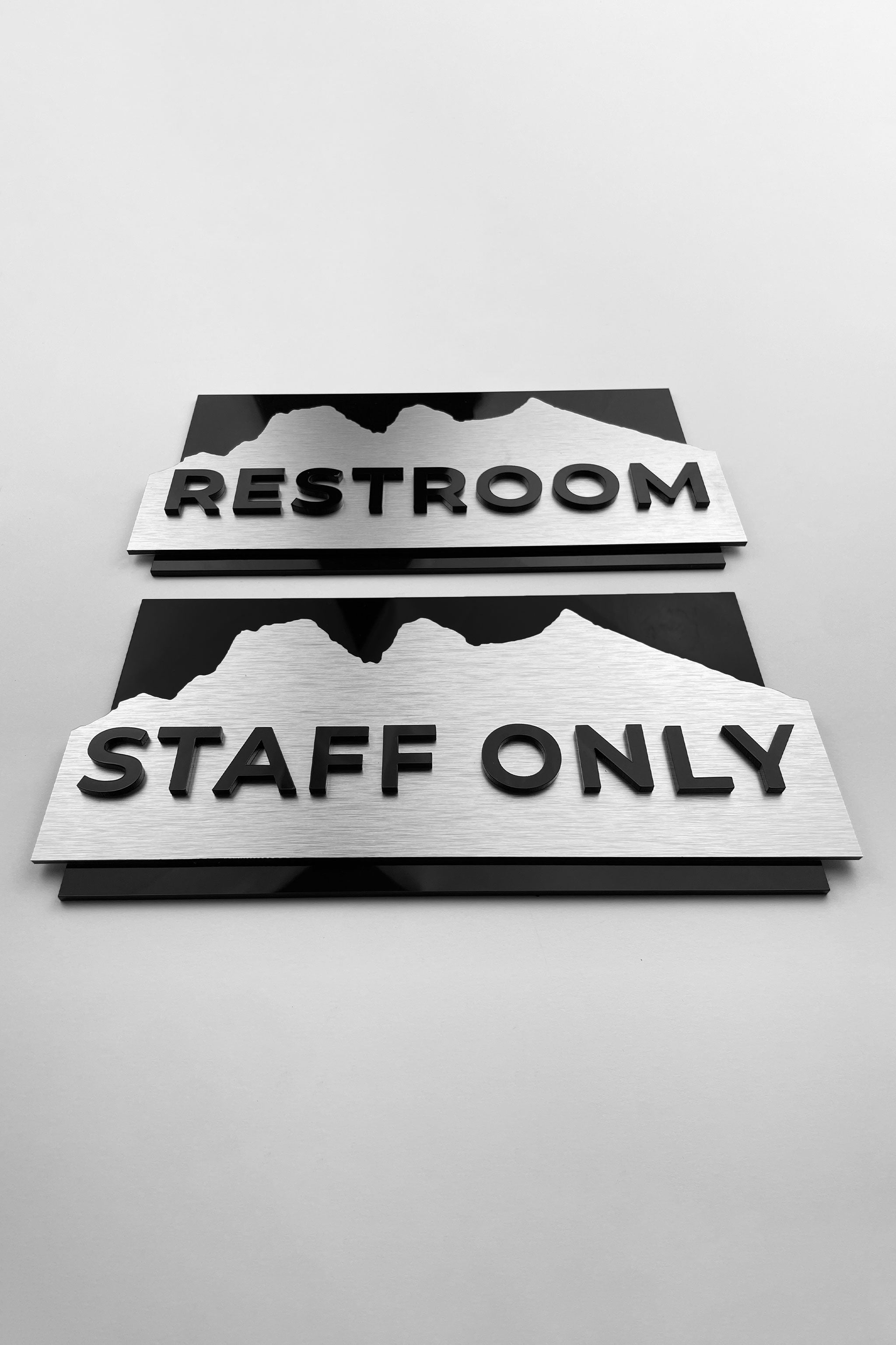 ALUMADESIGNCO Alpine Design custom made hotel door sign with brushed metal and acrylic text, staff only office restroom signage for hotels and commercial interiors