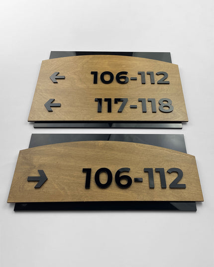 Birch wood and black acrylic arrow directional sign Flow Design by ALUMADESIGNCO, elegant wayfinding plaque for offices, hotels, corridors, and modern interior spaces