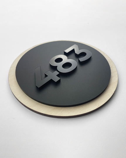 Round hotel room number sign by ALUMADESIGNCO crafted from birch plywood with raised black acrylic glass numbers, modern Scandinavian door number plaque for hotel corridors and apartments