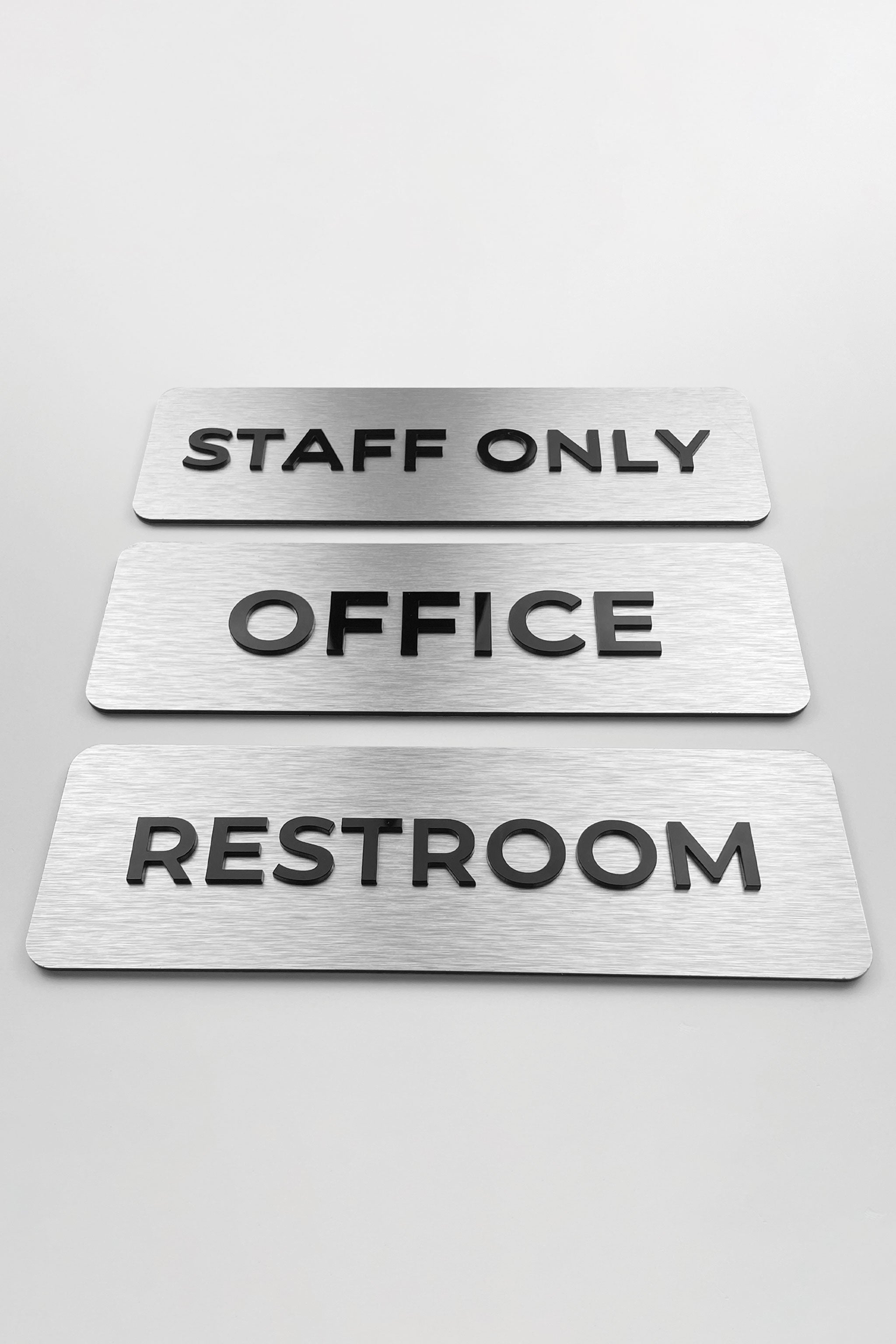 ALUMADESIGNCO silver metal office door plaque with black acrylic text, modern custom signage for offices, Airbnb properties, and commercial spaces