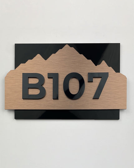 Premium Alpine brushed bronze room number sign by ALUMADESIGNCO featuring acrylic numbers, modern door signage for hotels, Airbnb properties, and offices