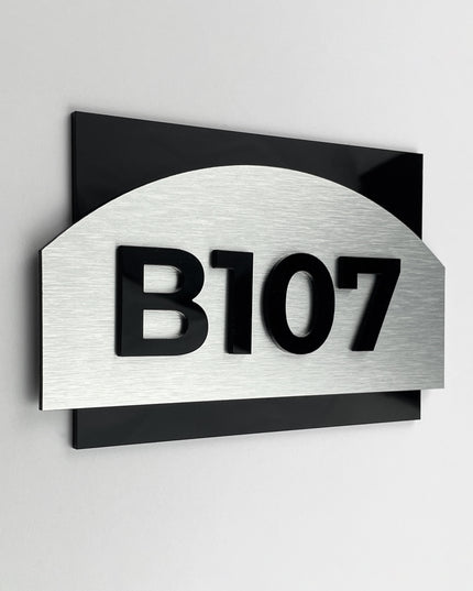 ALUMADESIGNCO Flow Design modern apartment door number sign with brushed silver plaque and black acrylic glass numbers, elegant signage for apartments and interiors