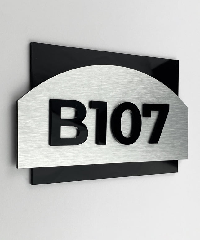 ALUMADESIGNCO Flow Design modern apartment door number sign with brushed silver plaque and black acrylic glass numbers, elegant signage for apartments and interiors