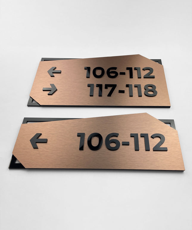 ALUMADESIGNCO wayfinding wall sign with brushed bronze plaque and black acrylic text, modern directional signage for offices, hotels, apartments, and commercial interiors