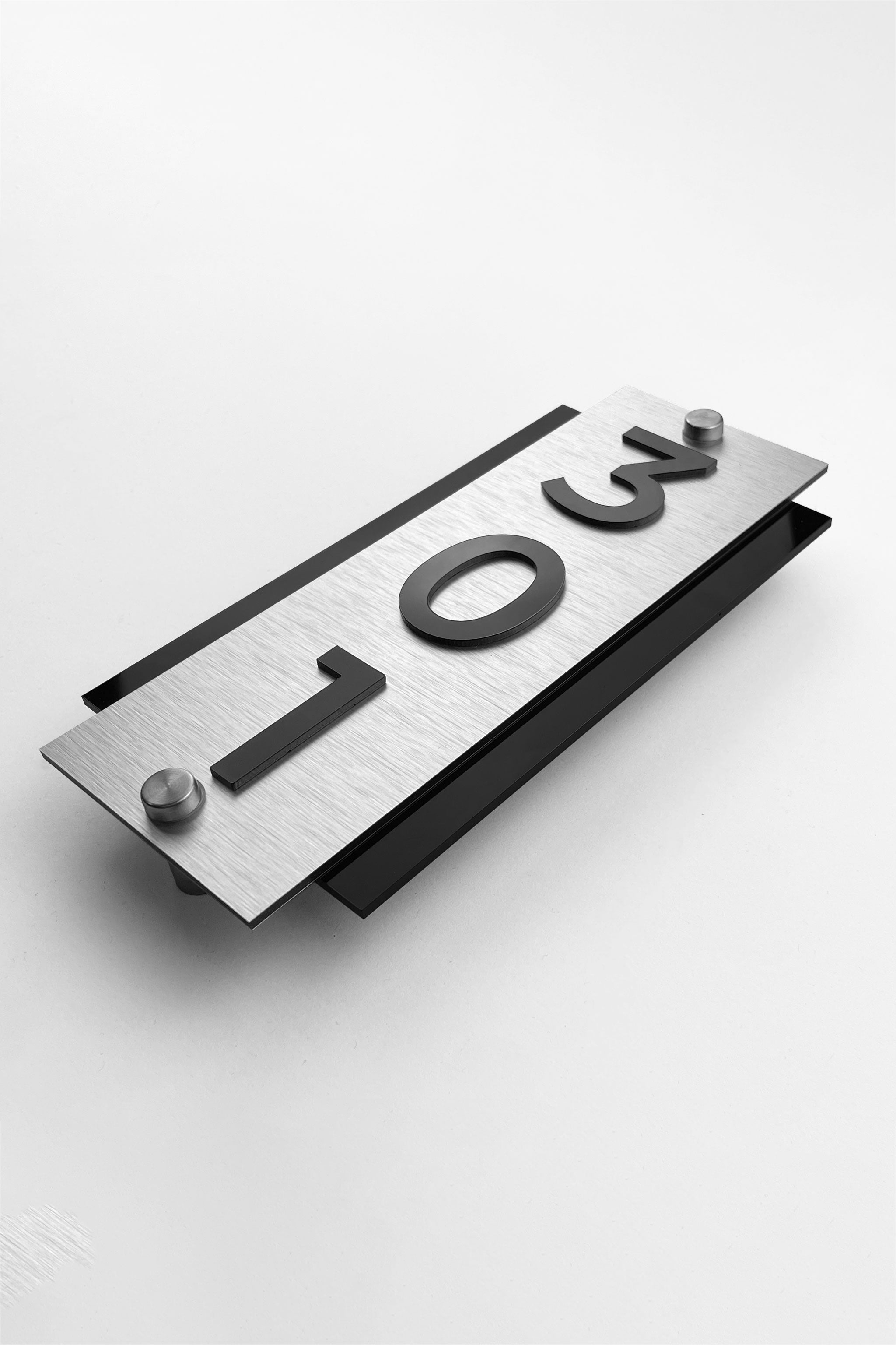 ALUMADESIGNCO vertical silver and acrylic hotel room number sign with standoff mounting, modern door plaque for hotels, apartments, and hospitality interiors
