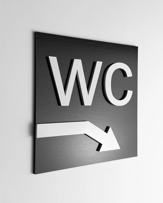 WC arrow downstairs sign by ALUMADESIGNCO, stylish toilet direction plaque for hotels, offices, restaurants, and public interior spaces