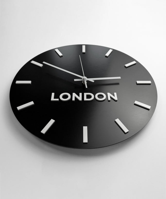 Personalized world time zone wall clock by ALUMADESIGNCO featuring brushed black finish and white acrylic glass city name plaques, elegant décor for offices, reception areas, and modern spaces