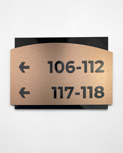 ALUMADESIGNCO Flow Design interior directional sign with brushed bronze plaque and acrylic text, premium wayfinding signage for offices, hotels, apartments, and contemporary interiors