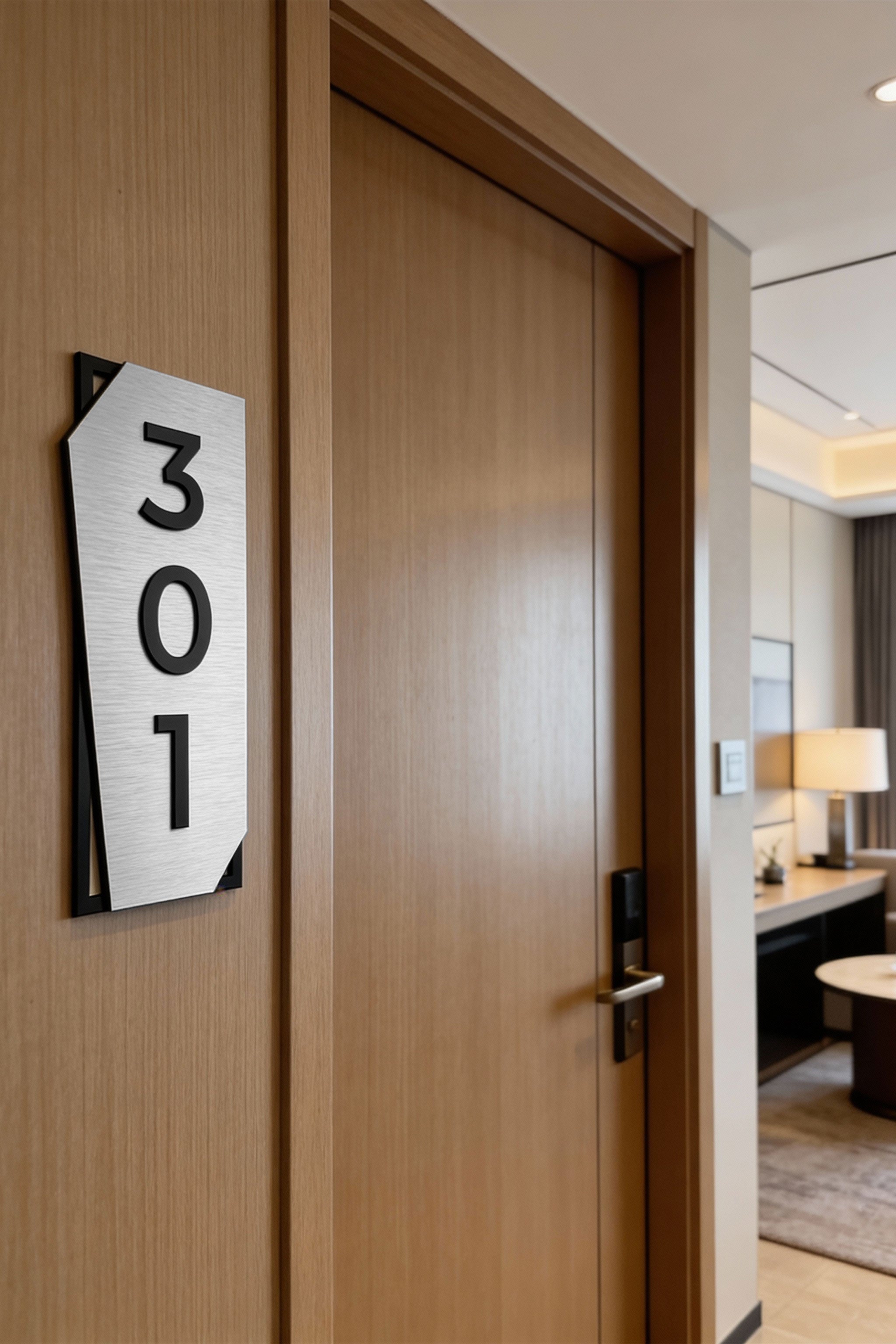 Vertical brushed silver and black acrylic glass door number sign by ALUMADESIGNCO, modern door plaque for hotel corridors and apartment buildings
