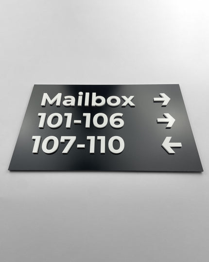 ALUMADESIGNCO directional wall plaque with black and white Modern Design styling, premium wayfinding signage for offices, hospitality spaces, apartment buildings, and interiors