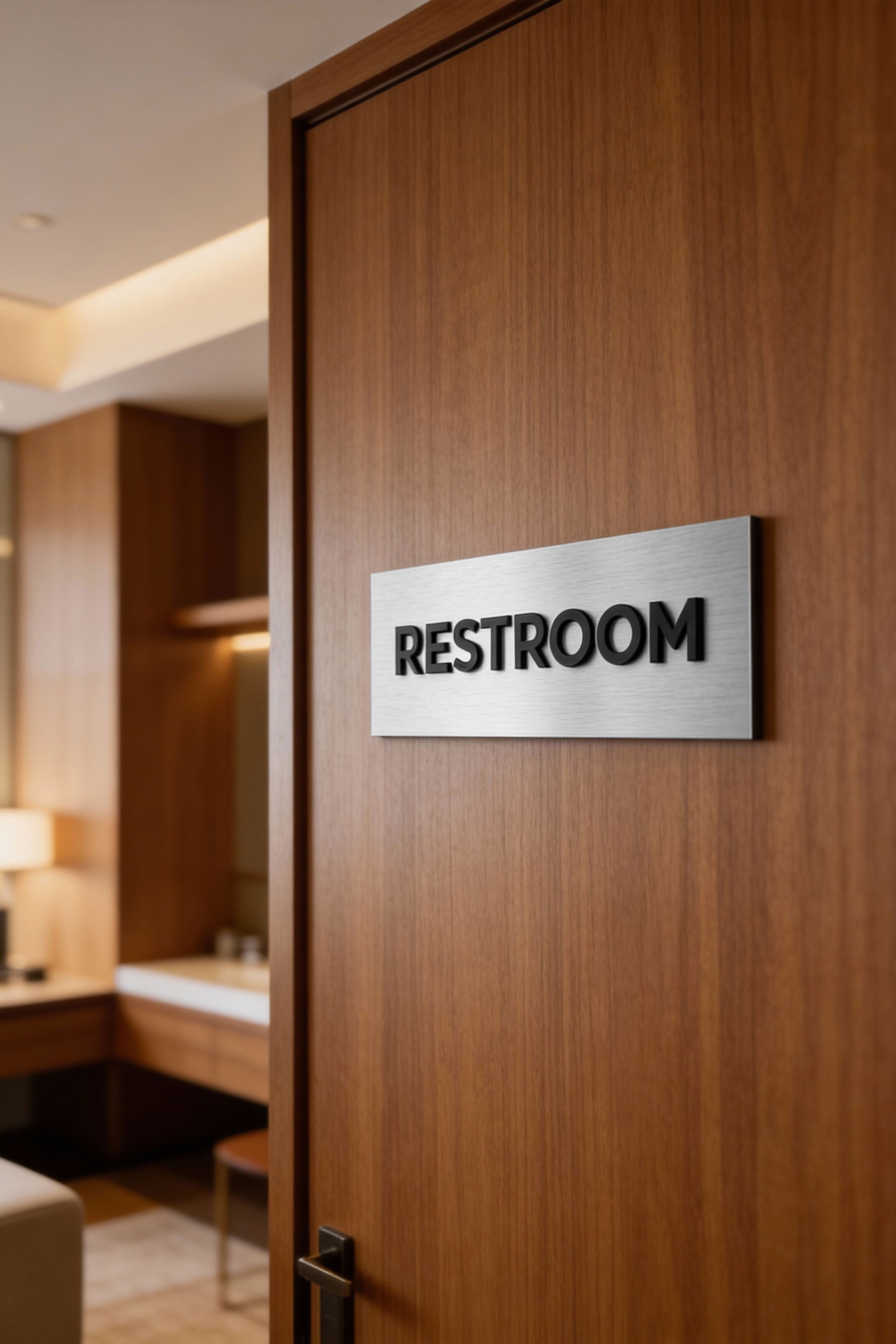 Modern custom door sign by ALUMADESIGNCO combining brushed silver metal panel and black acrylic lettering, stylish signage for offices and interiors