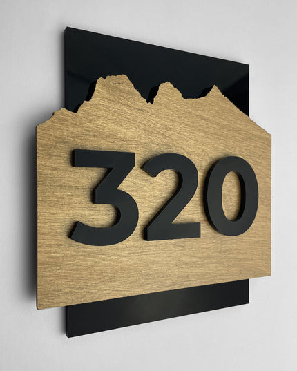 Modern Alpine Design door number sign by ALUMADESIGNCO crafted from birch plywood and black acrylic glass numbers, minimalist Scandinavian door plaque ideal for hotel rooms, offices, and luxury apartment corridors