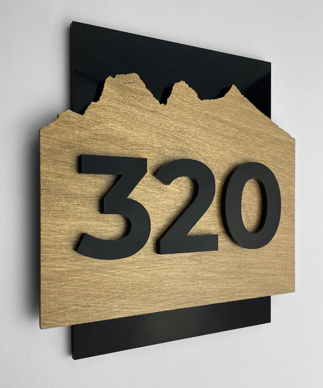 Modern Alpine Design door number sign by ALUMADESIGNCO crafted from birch plywood and black acrylic glass numbers, minimalist Scandinavian door plaque ideal for hotel rooms, offices, and luxury apartment corridors