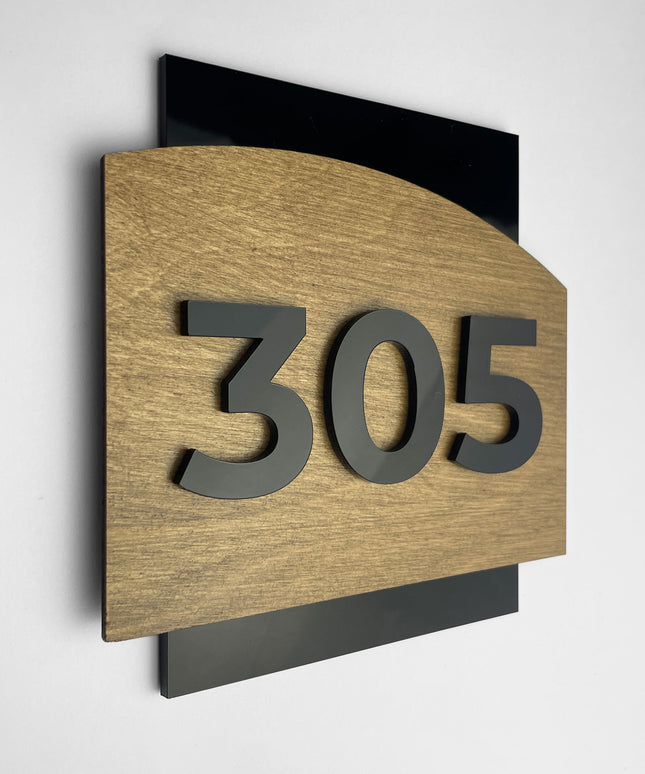 Custom door number sign by ALUMADESIGNCO crafted from birch wood and black acrylic numbers, modern wood and acrylic door plaque designed for hotel rooms, apartments, and contemporary interiors