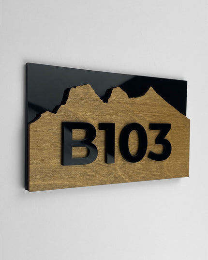 Birch plywood apartment door number sign Alpine Design by ALUMADESIGNCO featuring natural wood base and acrylic glass numbers for modern apartment and hotel interiors