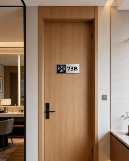 Brushed silver and acrylic glass suite room sign by ALUMADESIGNCO, stylish door signage for hotel suites, apartments, and contemporary interiors