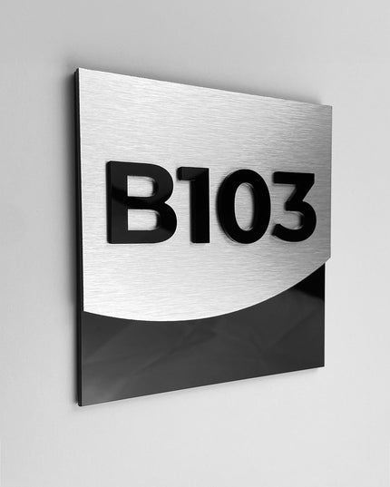 Luxury brushed silver hotel room number sign by ALUMADESIGNCO featuring metal plaque and acrylic numbers, elegant door signage for hotel corridors and apartment interiors