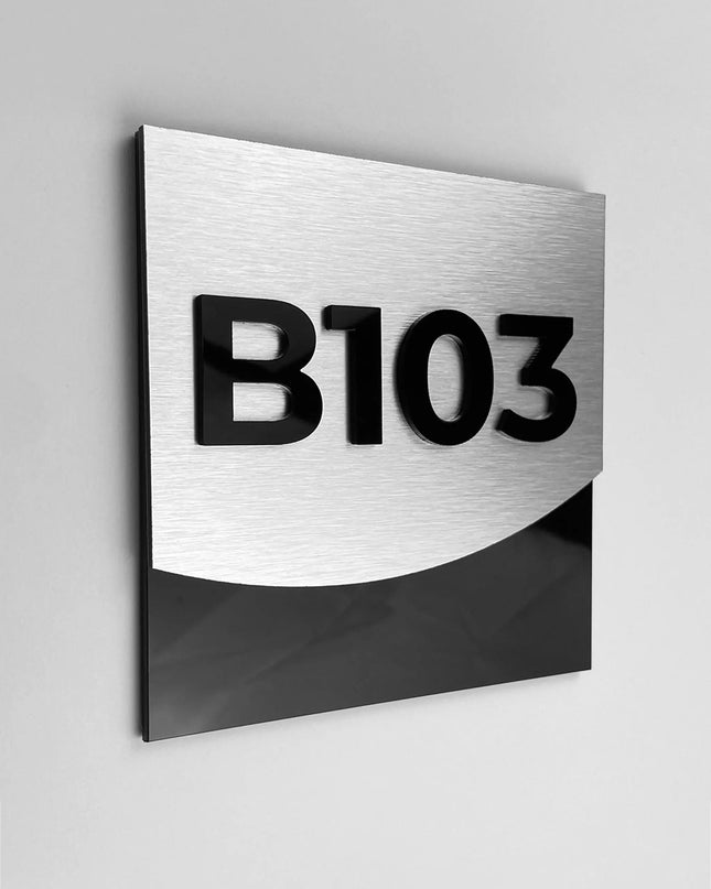 Luxury brushed silver hotel room number sign by ALUMADESIGNCO featuring metal plaque and acrylic numbers, elegant door signage for hotel corridors and apartment interiors