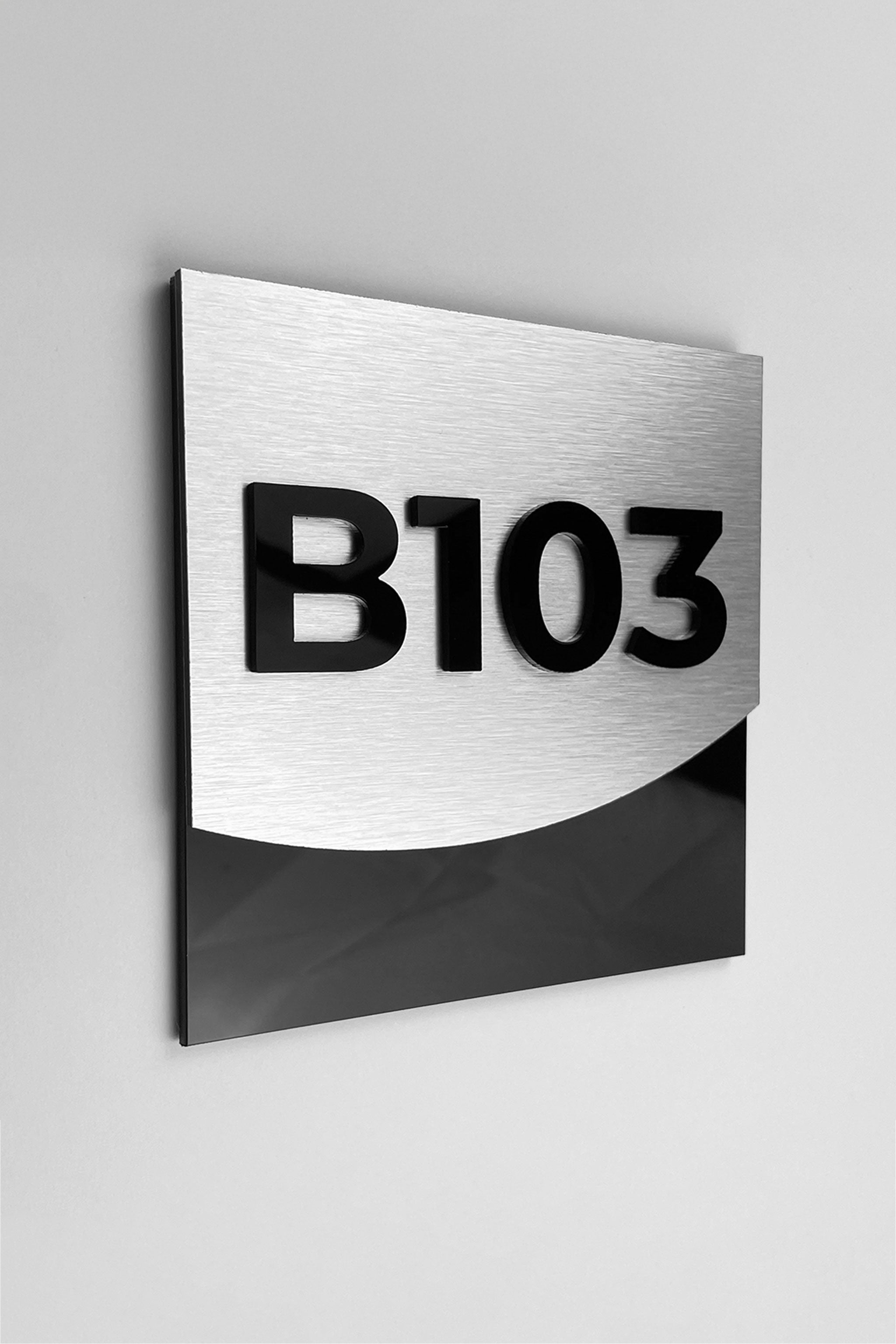 Luxury brushed silver hotel room number sign by ALUMADESIGNCO featuring metal plaque and acrylic numbers, elegant door signage for hotel corridors and apartment interiors
