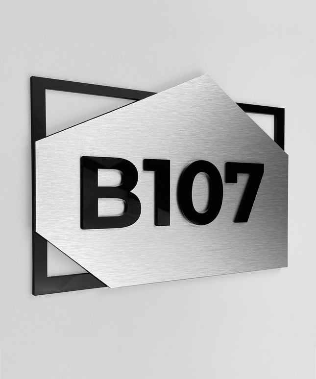 Brushed silver condominium room number sign by ALUMADESIGNCO featuring metal plaque and acrylic glass numbers, modern door number signage for apartments and residential buildings