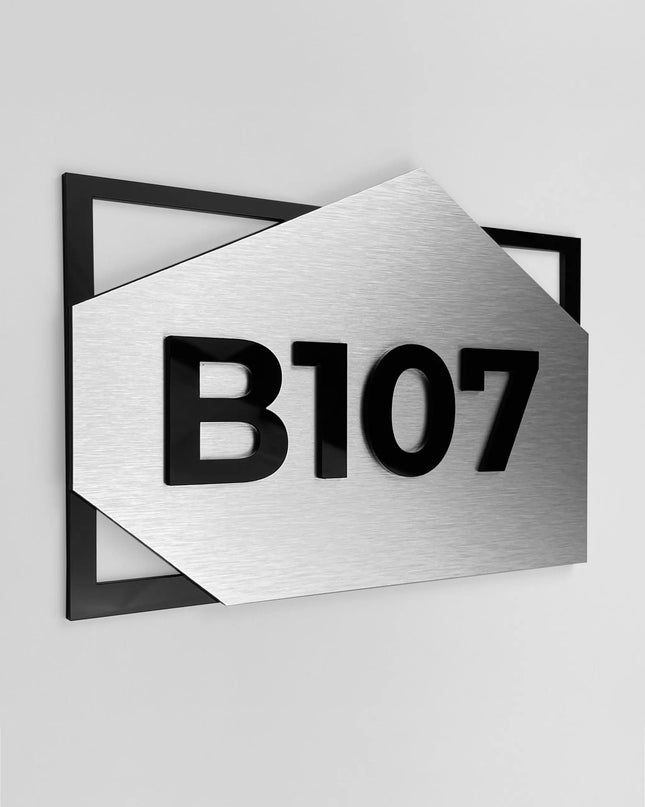 Brushed silver condominium room number sign by ALUMADESIGNCO featuring metal plaque and acrylic glass numbers, modern door number signage for apartments and residential buildings
