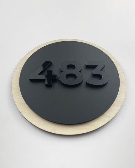ALUMADESIGNCO round wood and acrylic glass room number plaque with raised black acrylic numbers, modern Scandinavian hotel door signage for boutique hotels and Airbnb properties