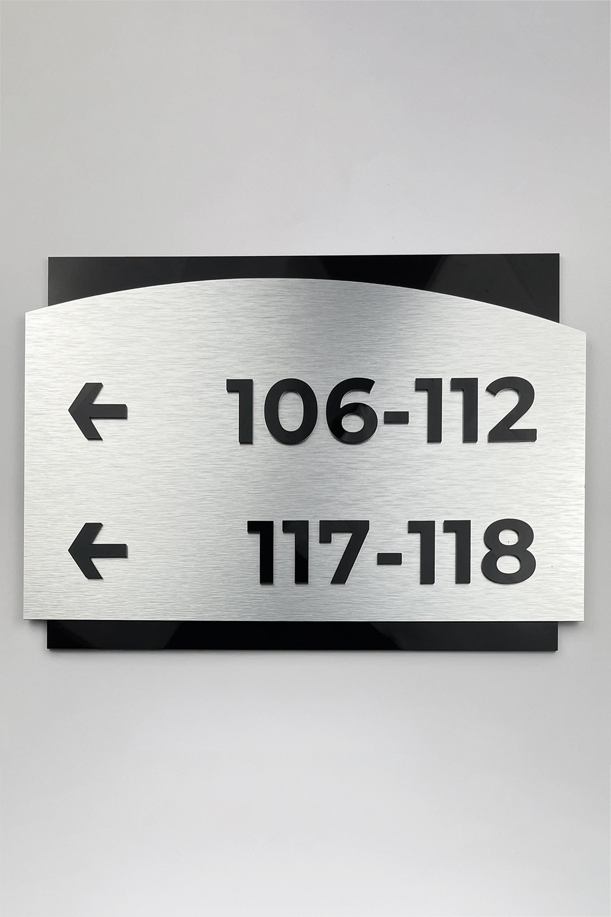 Directional wayfinding sign Flow Design by ALUMADESIGNCO featuring elegant modern styling, premium wall signage for offices, hotels, and apartment interiors