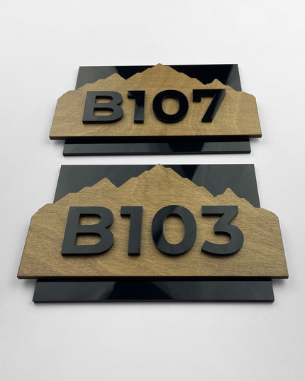 Hotel room number sign Alpine Design by ALUMADESIGNCO featuring birch plywood base with raised black acrylic numbers, modern Scandinavian wood and acrylic door plaque for hotel corridors and apartment buildings