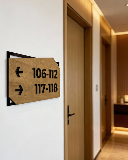 Modern personalized wayfinding sign by ALUMADESIGNCO combining birch wood plaque and black acrylic text, premium directional signage for hotels, offices, and contemporary interiors